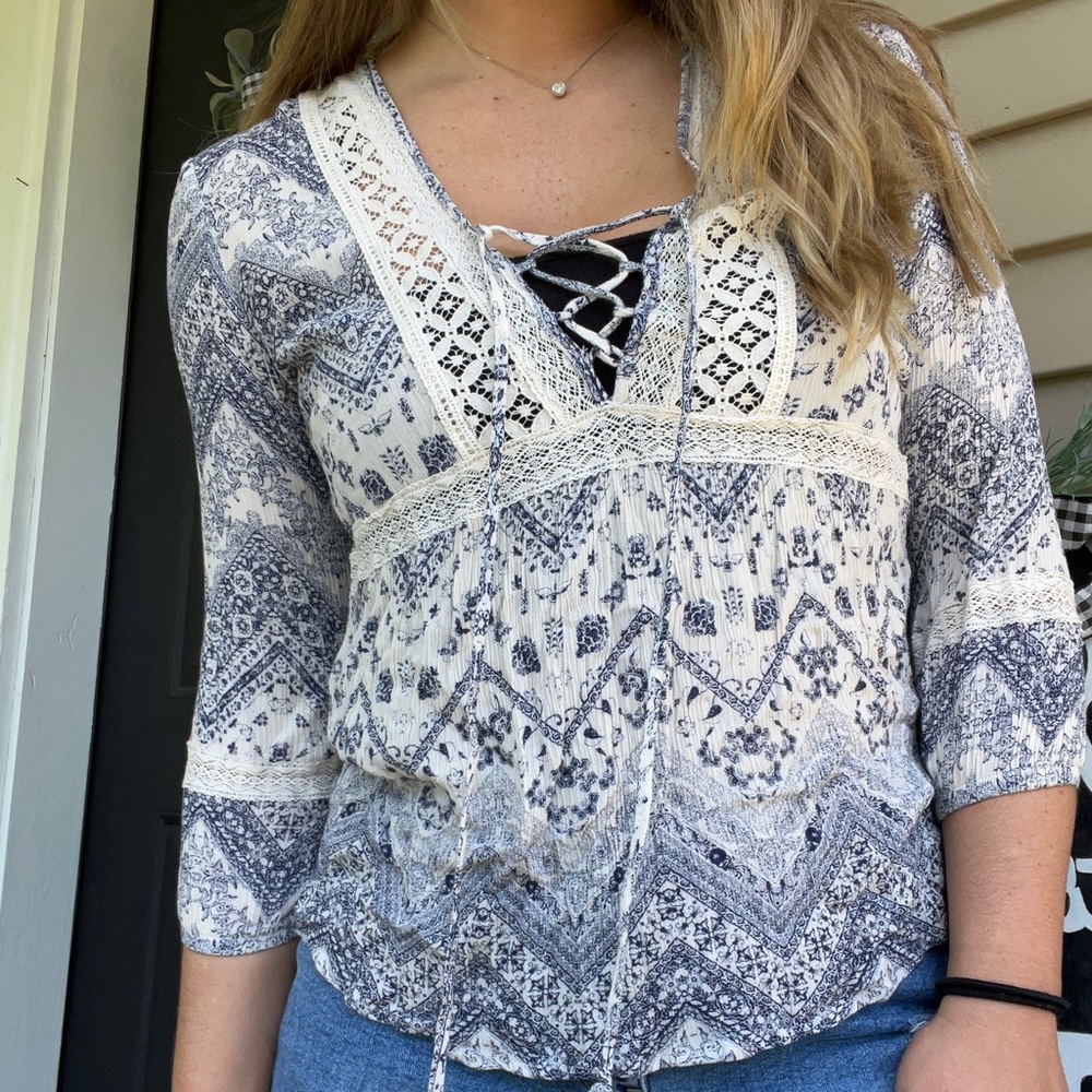 White and navy floral lace up blouse